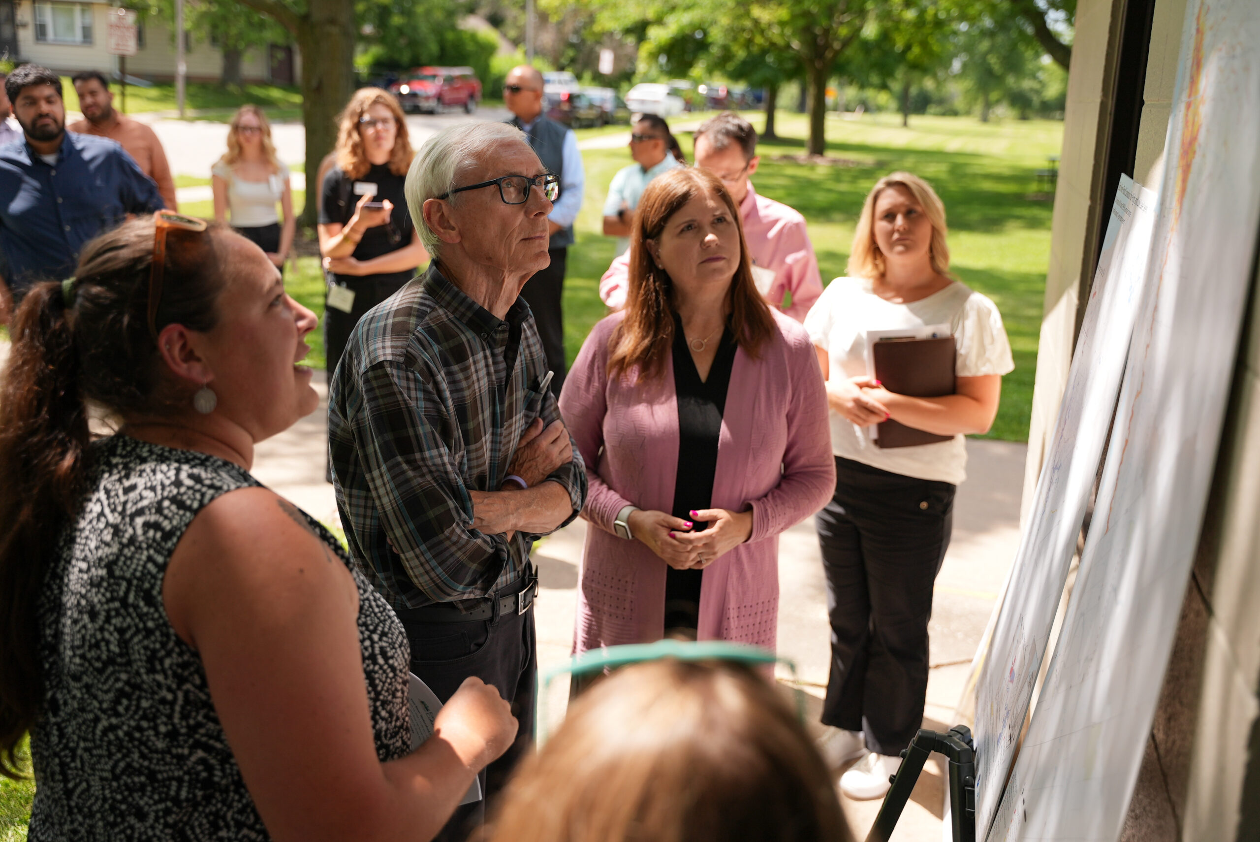 The Nature Conservancy's Kari Hagenow shows Governor Tony Evers a map of the East River watershed
