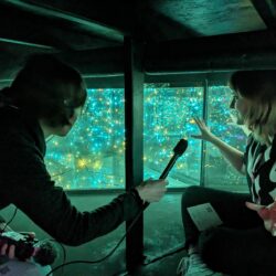 Jenna Mertz conducts an interview at the Deep Lake Future Exhibit