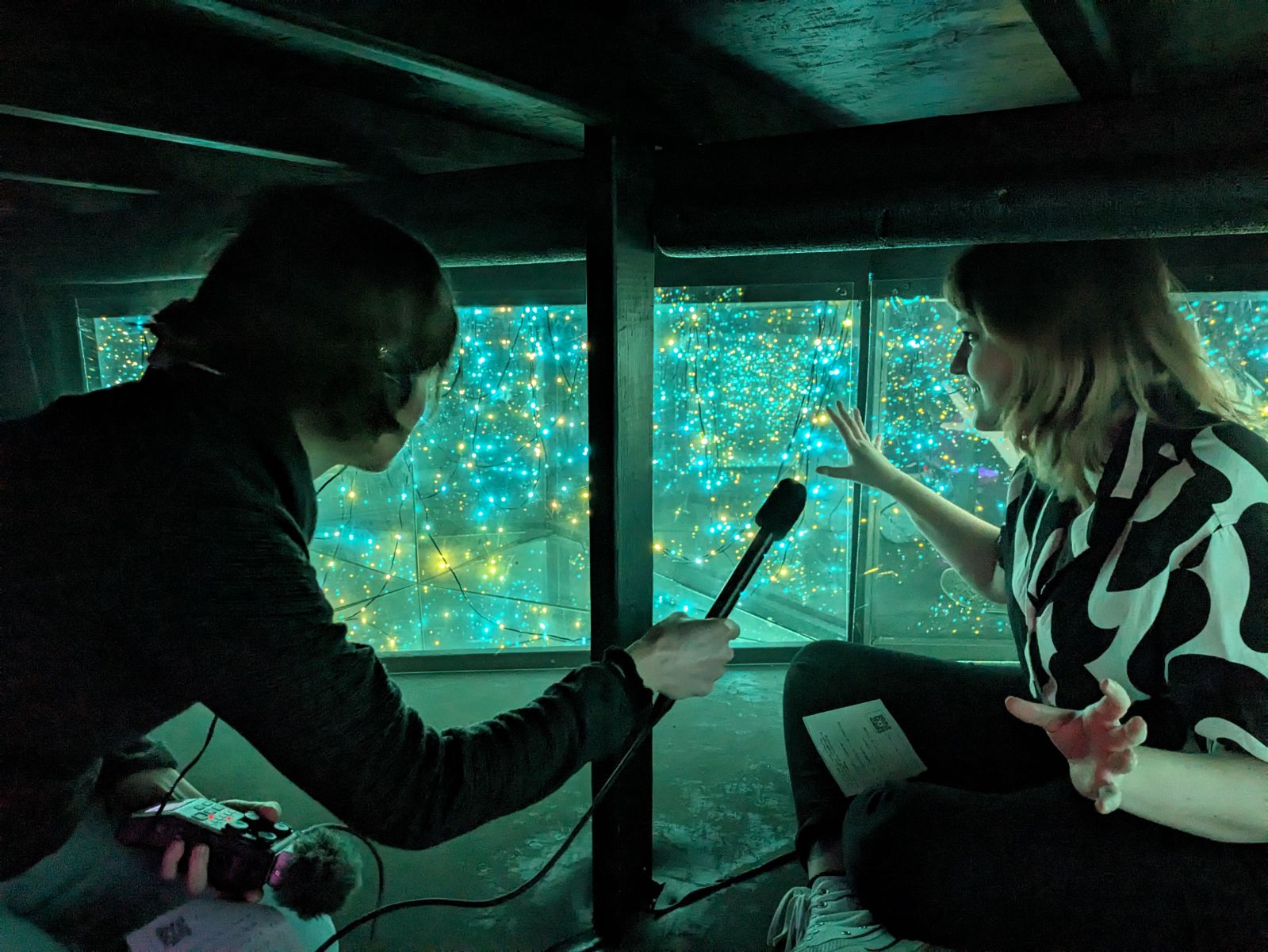 Jenna Mertz conducts an interview at the Deep Lake Future Exhibit