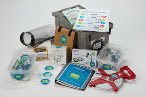Complete trash trunk kit spread out. Contents include written materials, containers, and other indecipherable objects.