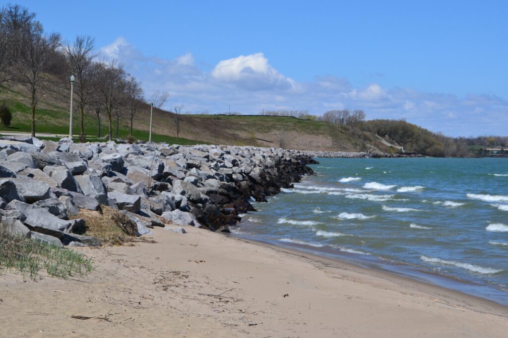 A revetment consisting of large rocks along the lake shoreline protects the bank and bluffs from further coastal erosion.