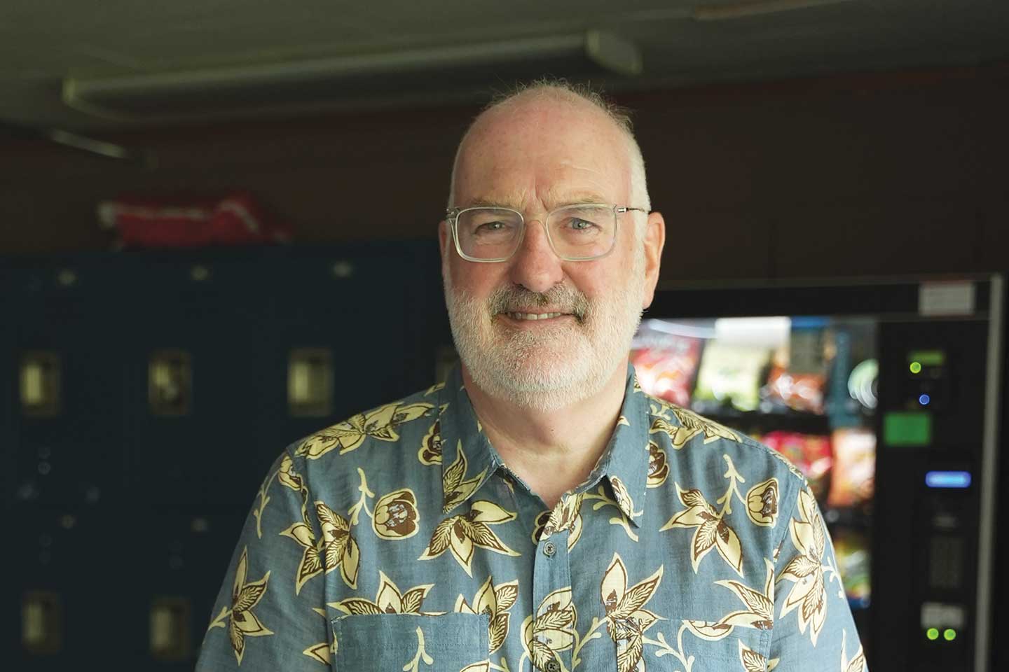 Headshot of bearded man wearing glasses.